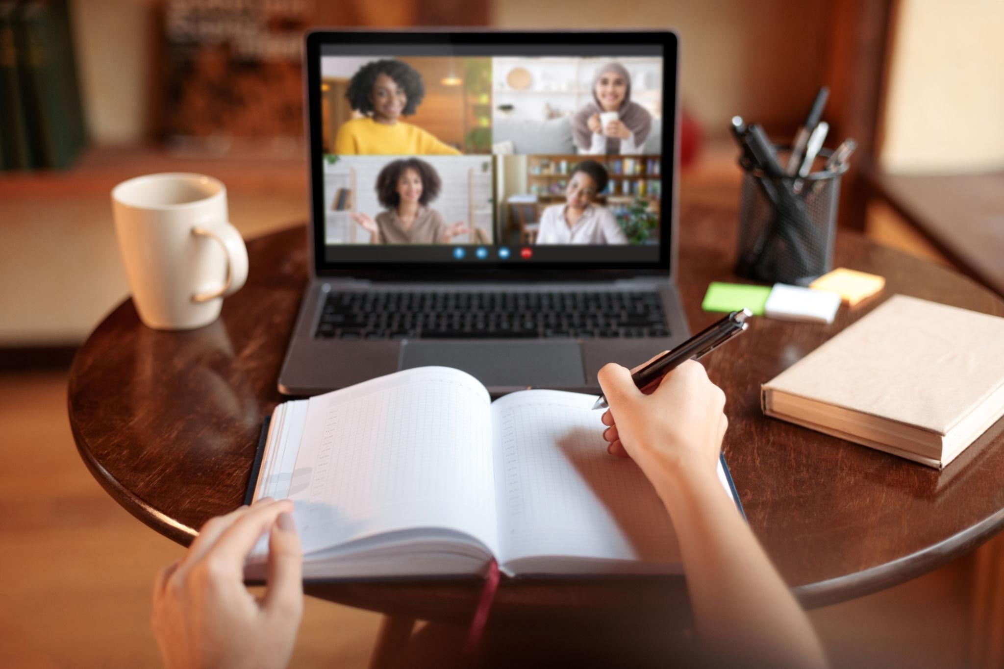 Online E-Ternal student taking notes during a remote class